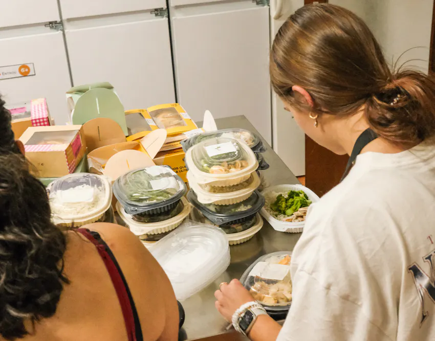 Two Adelphi University students volunteering with IVHQ on a food rescue project in Lisbon, Portugal.