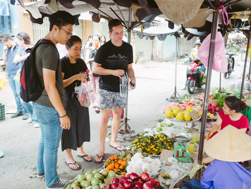 IVHQ volunteers in Vietnam experiencing a cultural immersion at a local market.