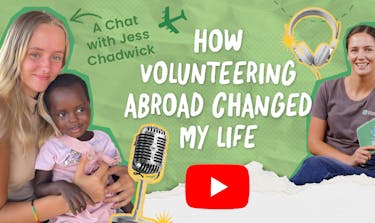 Jess Chadwick speaking into a studio microphone during a podcast interview about volunteering abroad.